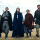 Seven castmembers of Amazon's The Wheel of Time adaptation stand side by side in a row.